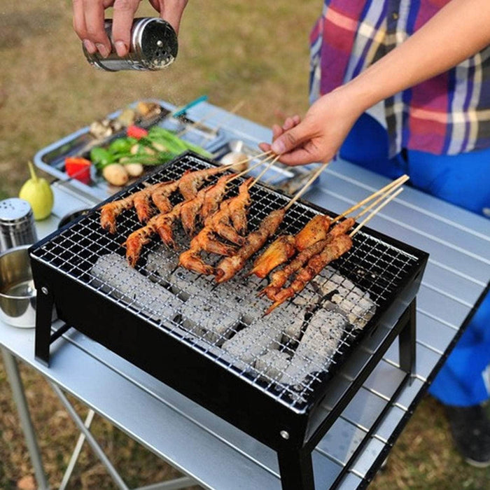 Parrilla plegable y portátil a carbón